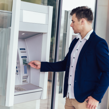 Man Using an ATM Machine